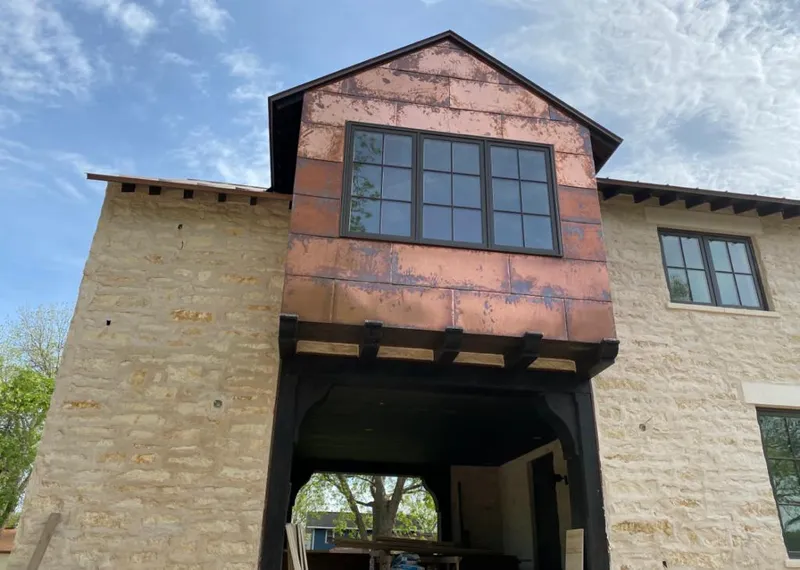 Copper metal panel facade on a stone building for Metal Roof Coating in Hayesville